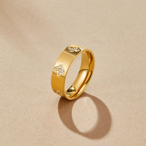 Anillo de banda de trébol de cristal dorado