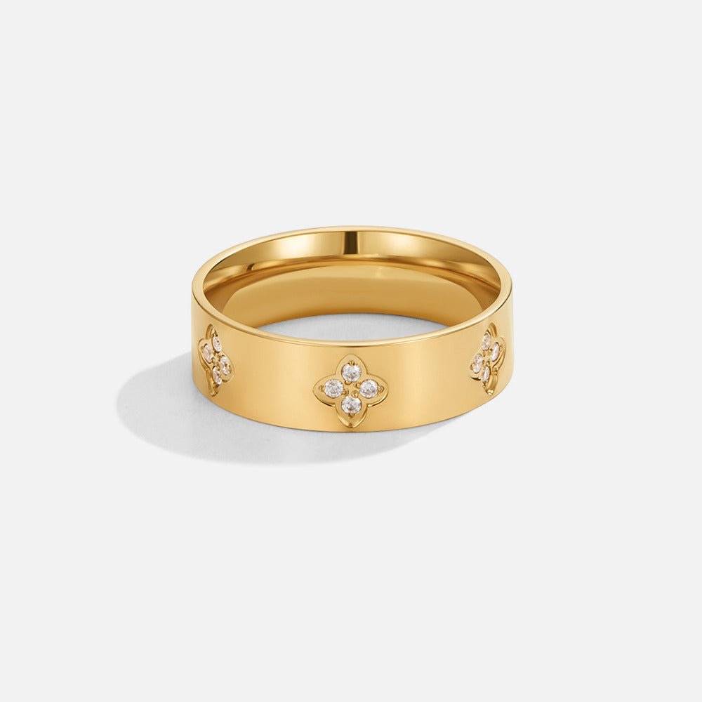 Anillo de banda de trébol de cristal dorado